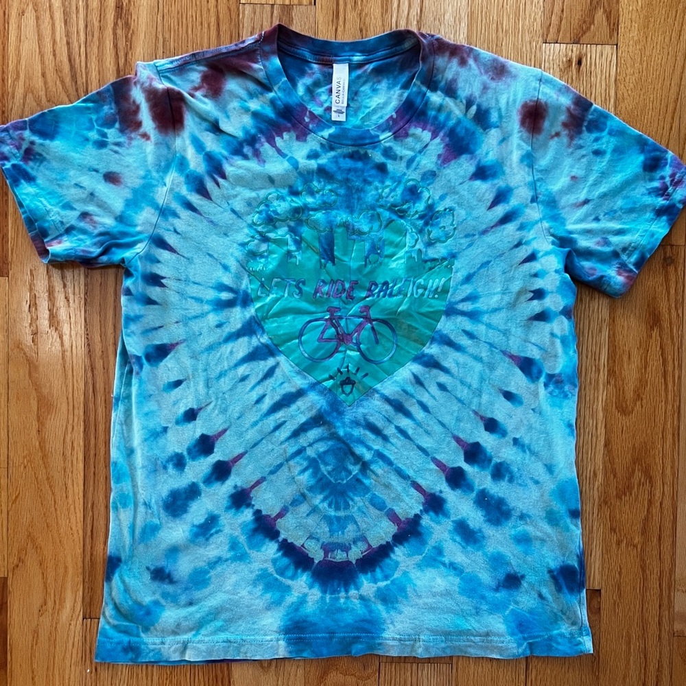 Custom tie dye shirt on “LET’S RIDE RALEIGH” printed shirt size Large